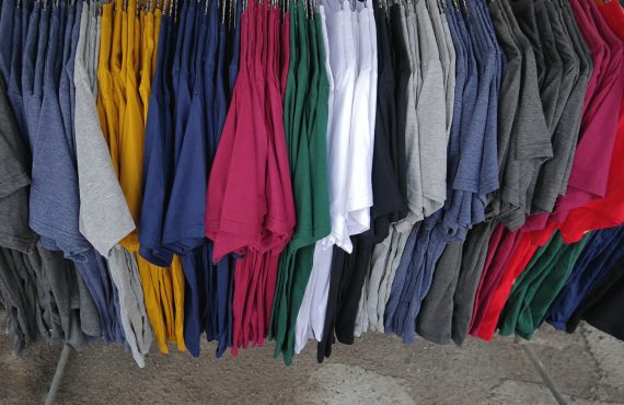 coloful plain casual t-shirts hanging on the rack